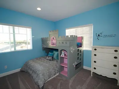 a childs bedroom with a castle bunk bed and a dresser at F-33 Walts Place in Anaheim