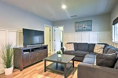 a living room with a couch and a flat screen tv at F-55 Donald Ducks Cottage in Anaheim