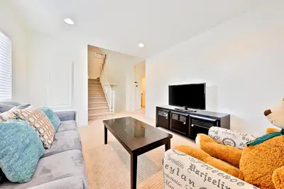 a living room with a couch and a tv at F-56 Winnie the Poohs Treehouse in Anaheim