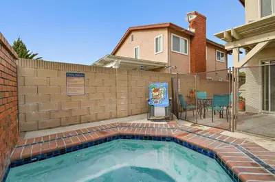 a swimming pool in front of a brick wall at F-57 Pride Rock in Anaheim