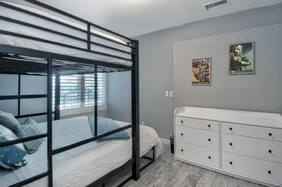 a bedroom with two bunk beds and a dresser at F-58 Mandos Hideaway in Anaheim