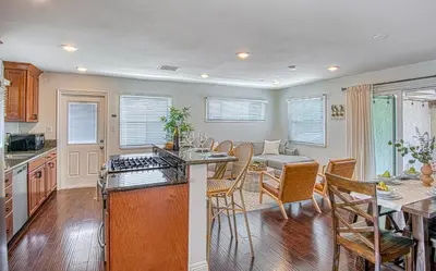 a kitchen and living room with a table and chairs at F-59 Goodhue in Anaheim