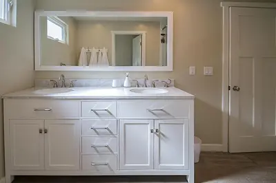 a bathroom with two sinks and a large mirror at F-60 Disney Dream Craftsman in Anaheim