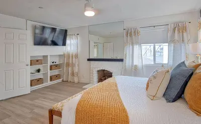 a bedroom with a bed and a fireplace at F-64 California Vibes in Anaheim