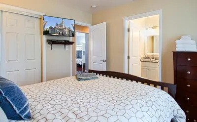 a bedroom with a bed and a bathroom at F-18 Babes in Toyland in Anaheim