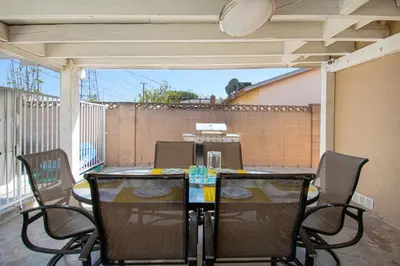a patio with a table and chairs on a porch at F-18 Babes in Toyland in Anaheim