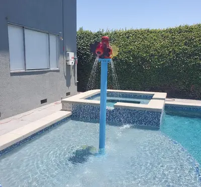 a red fire hydrant in a swimming pool at F-21 Castle House 1 in Anaheim