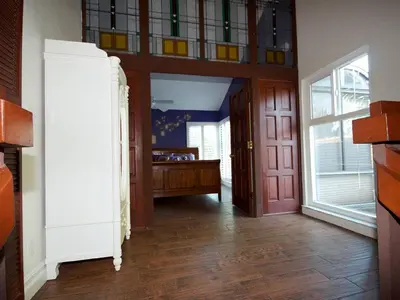 a hallway with a door and a room with a bedroom at F-23 Rapunzels Tower in Anaheim