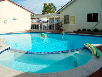 a large blue swimming pool with toys in it at F-24 Mickeys House in Anaheim