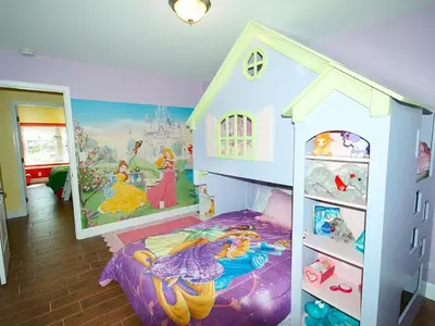 a childs bedroom with a disney themed bed at F-34 Minnies House in Anaheim