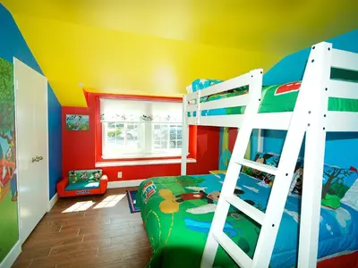 a childs bedroom with a bunk bed and a ladder at F-34 Minnies House in Anaheim
