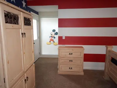 a room with an american flag painted on the wall at F-30 Small World in Anaheim