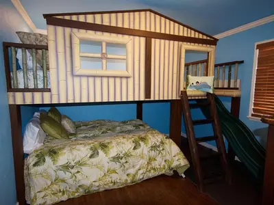 a bedroom with a bunk bed and a ladder at F-30 Small World in Anaheim