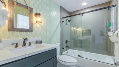 a bathroom with a sink and a toilet and a shower at F-27 Carnelian in Anaheim