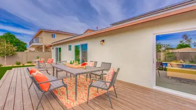a patio with a table and chairs on a deck at F-27 Carnelian in Anaheim