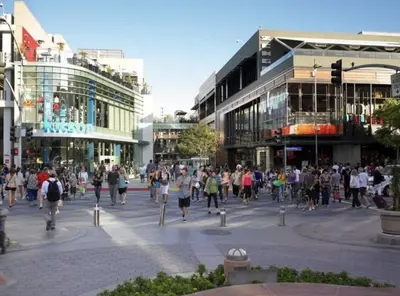 a large group of people walking in a city street at Prime Santa Monica 1 bed & bath in Los Angeles