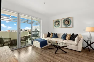 a living room with a couch and a table at Luxury Penthouse 2-BR - with Pool & Gym Access in Los Angeles