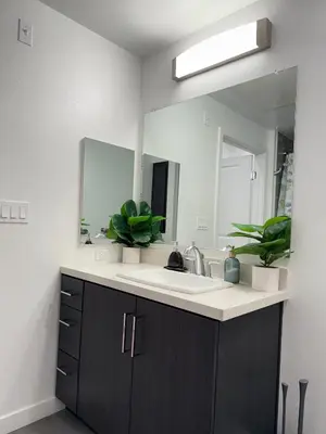 a bathroom with a sink and a mirror at Vine Loft FREE DESIGNATED PARKING & WIFI close to Universal Studios in Los Angeles