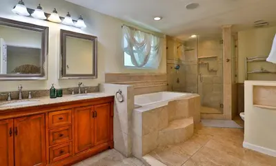 a bathroom with a tub and a sink and a shower at City Paradise Saltwater Pool-Spa and Ping-Pong in Los Angeles