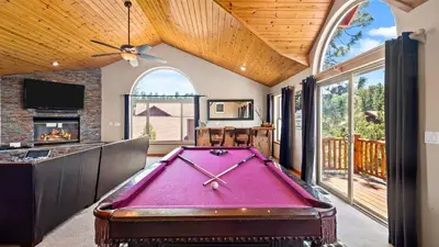 a pool table in a living room with a pool table at Sleeps 27 2 Homes Near the Lake Hot Tub Views Castle Glen Estates in Big Bear Lake