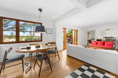 a living room with a table and a couch at The Robinson Tree House in Silver Lake in Los Angeles