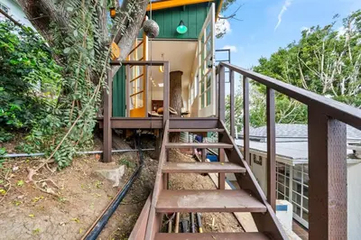 a wooden staircase leading up to a house at The Robinson Tree House in Silver Lake in Los Angeles