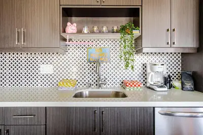 a kitchen counter with a sink and a mixer at Colorful penthouse near DTLA in Los Angeles