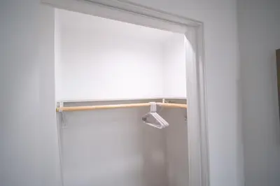a bathroom door with a towel rack and a window at Stylish Private Room by Downtown LA with Private Parking in Los Angeles