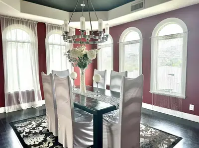 a dining room with a black table and white chairs at Room with a view in the Hills of Studio City -B in Studio City