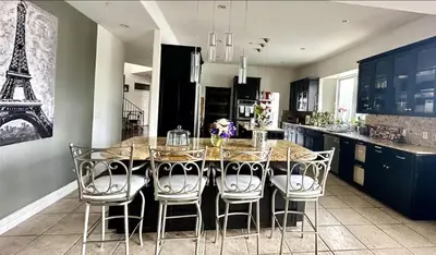 a kitchen with a table with chairs and the eiffel tower at Room with a view in the Hills of Studio City -B in Studio City