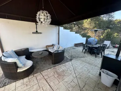 a patio with a couch and chairs and a table at Room with a view in the Hills of Studio City -B in Studio City
