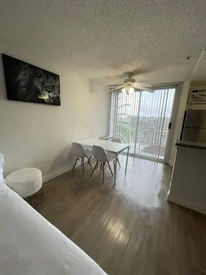 a room with a table and chairs and a bed at Hollywood Spectacular Loft FREE Designated parking in Los Angeles