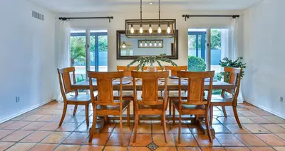 a dining room with a table and chairs at Estate with Heated Pool & Jacuzzi & Tennis Court in Sherman Oaks Community Hospital Heliport