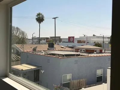 a view of a city from a window at Newly constructed 2 bedroom by La Cienega Plaza with parking, modern kitchen, washer dryer and very central to attractions in Los Angeles