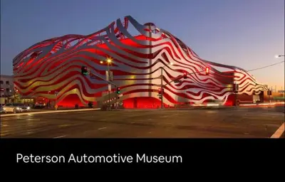 a multicolored building on a city street at night at Newly constructed 2 bedroom by La Cienega Plaza with parking, modern kitchen, washer dryer and very central to attractions in Los Angeles