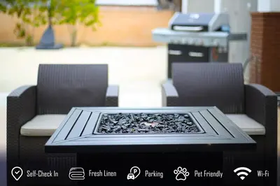 a table with two chairs and a fire pit at 6BR 3BA Home near Disneyland in Anaheim