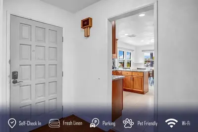 a white door in a kitchen with a counter top at 6BR 3BA Home near Disneyland in Anaheim