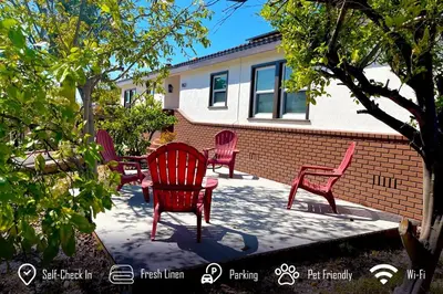 a group of red chairs sitting on a patio at 6BR 3BA Home near Disneyland in Anaheim