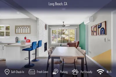 a kitchen and dining room with a table and chairs at Chic 4B2B Townhome Private Pool in Long Beach