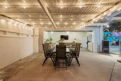 a dining room with a table and chairs at Blue Haven Solar Pool Heat Parking Billiards in Long Beach