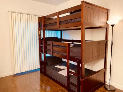 a bunk bed in a room with a lamp at Riverton Place NoHo in Los Angeles