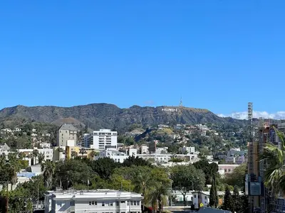 a view of a city with a mountain in the background at Penthouse 2 Bedroom with Hollywood Sign View! in Los Angeles
