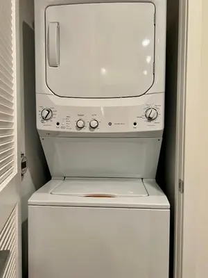 a white washer and dryer in a room at Penthouse 2 Bedroom with Hollywood Sign View! in Los Angeles