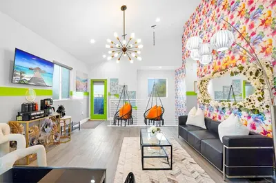 a living room with a couch and a colorful wall at A- Stylish and Comfy NoHo Retreat- 5 Star Area, Hot Tub in North Hollywood