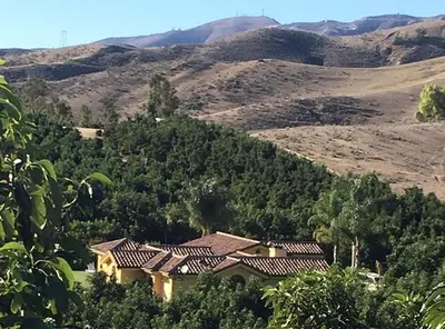 a house sitting in the middle of a mountain at Romantic and Relaxing Villa Retreat with a Jacuzzi near Somis, California in Somis