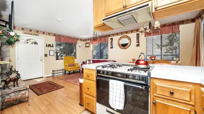 a kitchen with a stove and a tea kettle on it at Charming Cabin for Winter and Water Sports Fans Near Big Bear Lake, California in Arrowbear Lake