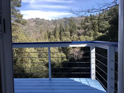 a balcony with a view of the mountains at Unique Three-Level Dome near Lake Gregory in Crestline, California in Crestline