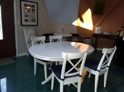 a white table and chairs in a room at Unique Three-Level Dome near Lake Gregory in Crestline, California in Crestline