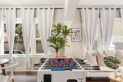 a living room with a large chess game on a table at Sunset Shores - Near the beach - Games - Sleeps 8 in Long Beach