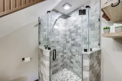 a shower with a glass door in a bathroom at 3 Mi to Lake Arrowhead Village Pine-View Home! in Lake Arrowhead